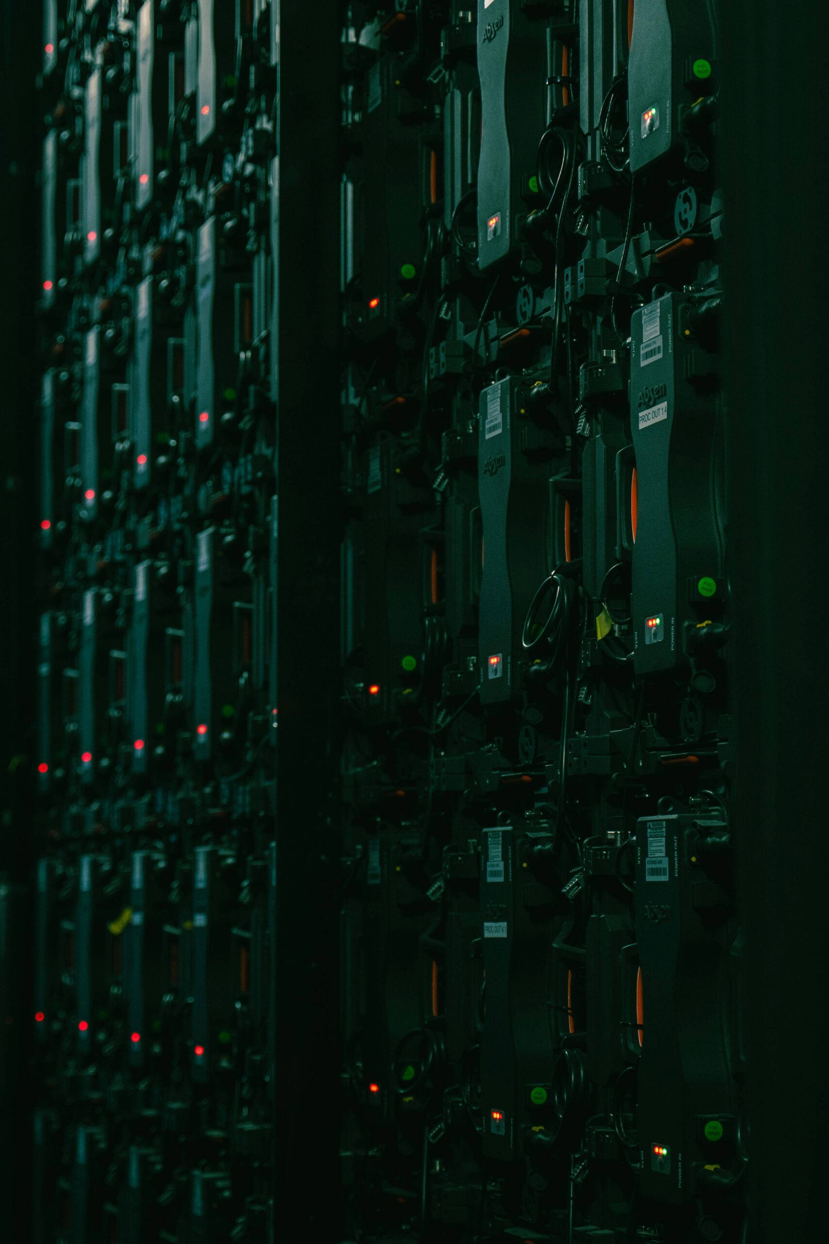 Rows of server racks with status lights in a data center